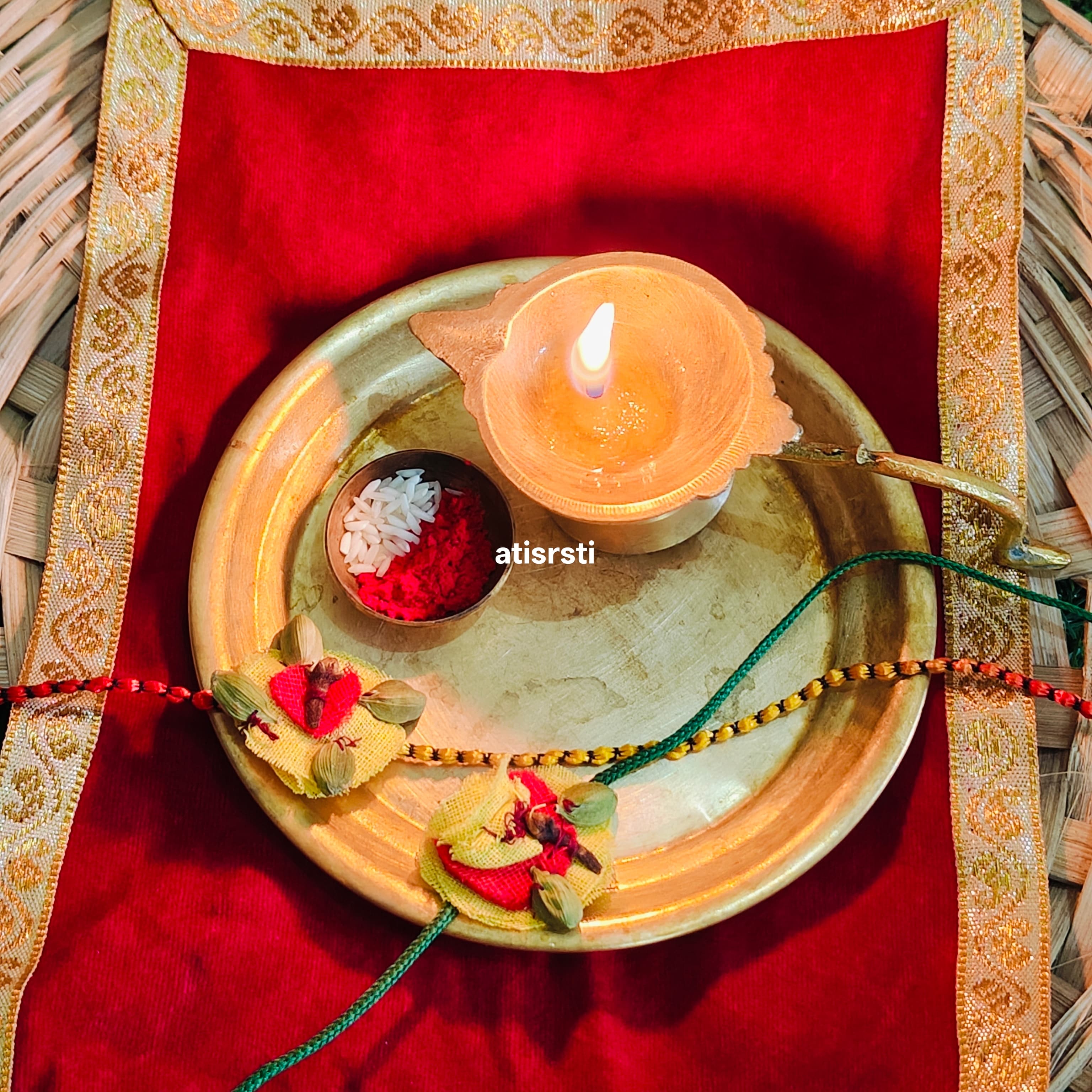 Eco-friendly handmade Rakhi crafted with fragrant laung, elaichi and makhana, featuring traditional resham thread and made by women artisans.